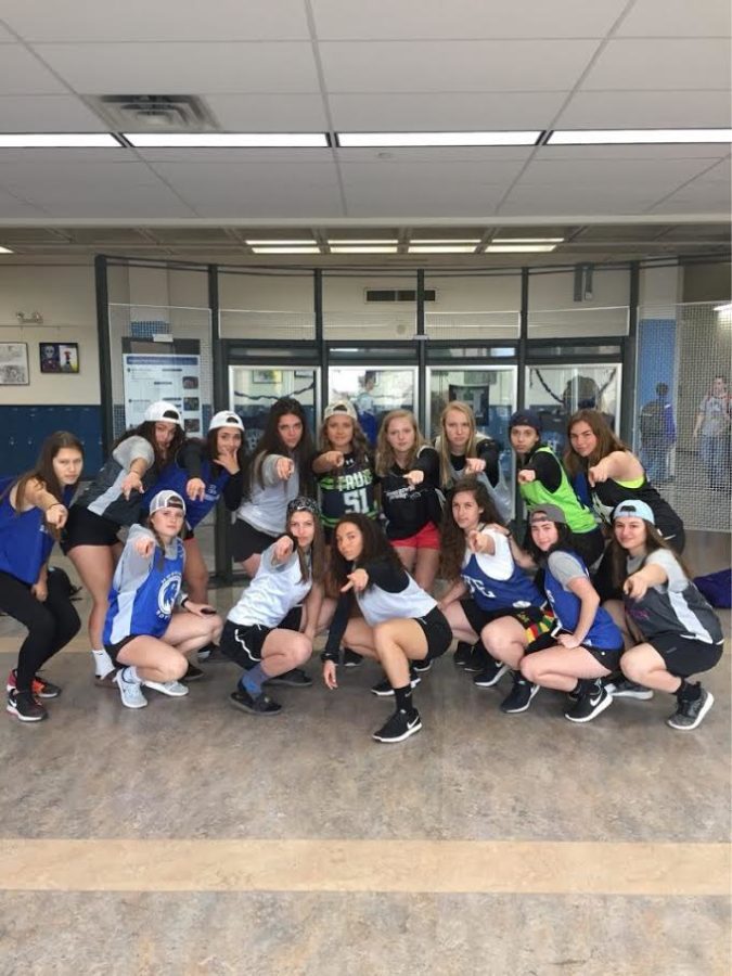 The girls lacrosse team poses during school with their spirit clothes on. Photo was taken the day of Royals vs Trojans, where they won their first conference match in two years. 