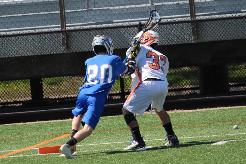 Cole Kristal, sophomore, defends a member of the St. Louis Park Orioles in the JV teams winning game on May 6. This is Kristal’s first year playing lacrosse.