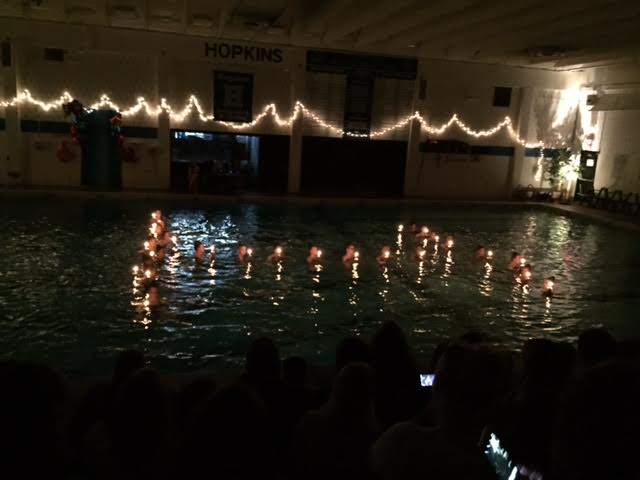 The Royals synchronized swimming team forms an H in the pool during their traditional candle-lighting ceremony at the teams show on May 12.