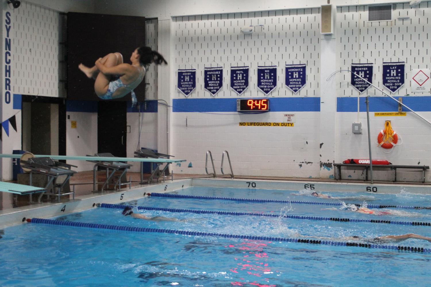 Yasmin Nachmias, freshman, performs a back somersault dive during practice on Sept. 13.