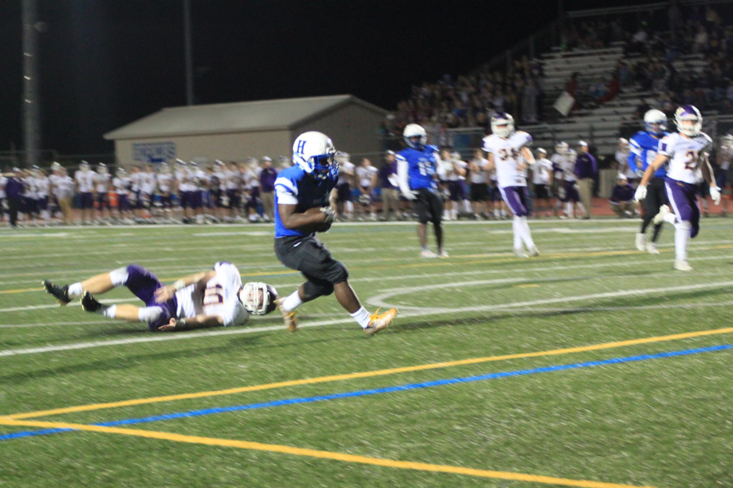 XZarion Hill, senior, dukes out defender after catch. The Royals lost to the Wildcats. 