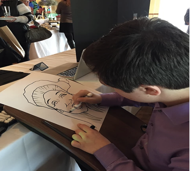 Grant Cohen, senior, works on a caricature piece.