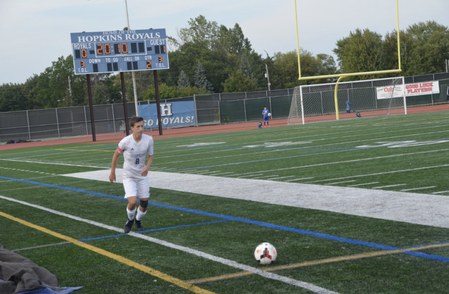 Mitchell Levesque, senior, captain looks to pass ball downfield. 
