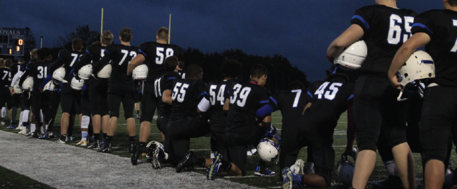 Royals football players kneel during the National Anthem. Kneeling during the National Anthem and not standing for the Pledge of Allegiance have become widespread phenomena at HHS and in the nation.