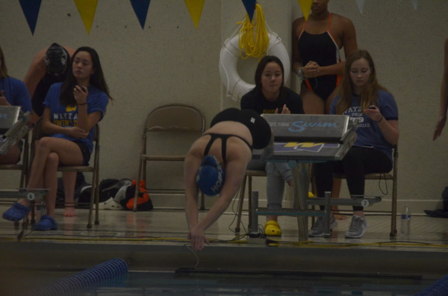 Samantha Horowitz, senior, dives into the pool to begin her 200 freestyle race. Horowitz placed nineteenth in the event with a time of 2:10.78.