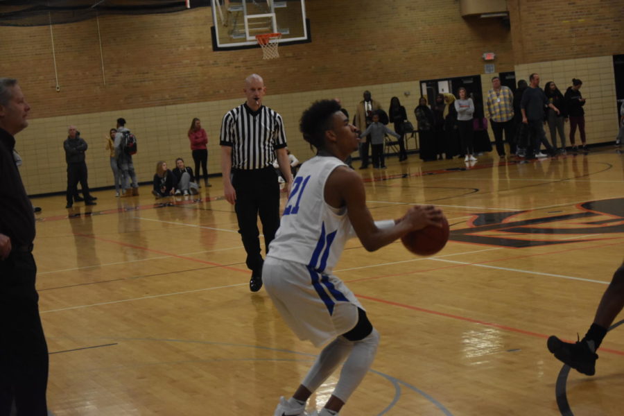 Anthony Davis, senior, pulls up for three pointer against Orioles. 