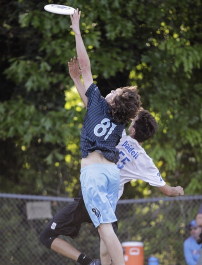 AJ Condon, senior, goes up against defender and grabs the disc for the score. Condon has been a part of HURT since eighth grade and is now the captain.