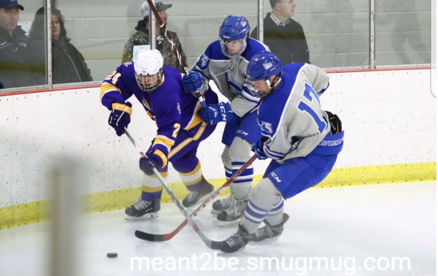 JJ Martin, junior, fights for the puck in a loss to Cloquet-Esko-Carlton. The Royals have one game left in the regular season.