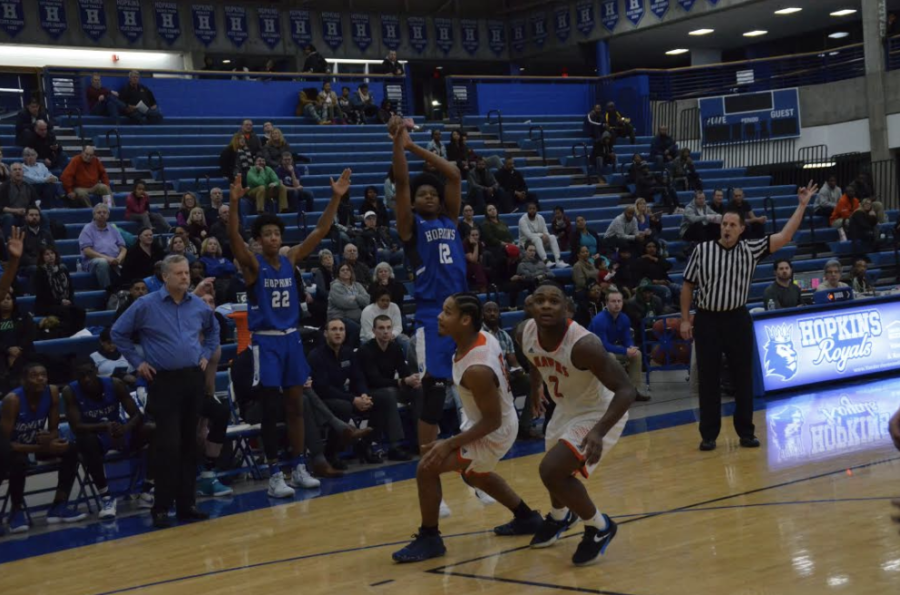 Kerwin Walton, junior, pulls up for a 3-point shot. The Royals open up the season against top-ranked East Ridge.