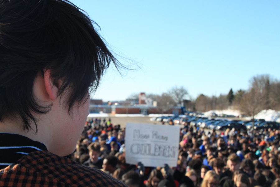 Shannon Maroney, senior, gazes over the crowd of HHS and NJH students participating in the walkout.
