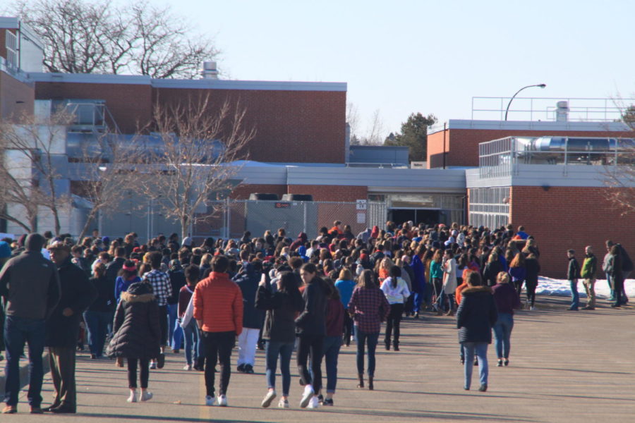 Students file back into NJH in silence after 17 minutes of protest, rallies, and unity during the walkout. The walkout included participants from both HHS and NJH, uniting across six grades to end gun violence.