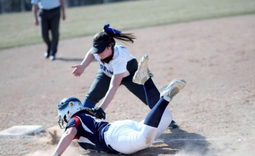 Parker Stoddard, junor, tags out an Orono Spartan in their win at home. The Royals won the game 15-7.