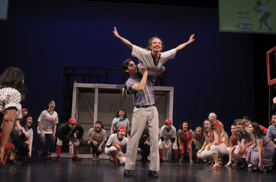 Gabe Kemper and Anna Anderson, seniors, performing a lift in Damn Yankees. One Acts take place in the near future.