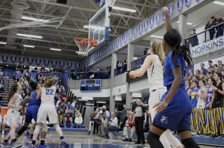 Kayhla Adams, junior, fires up a three from the corner. The Royals took down Wayzata to advance to state.