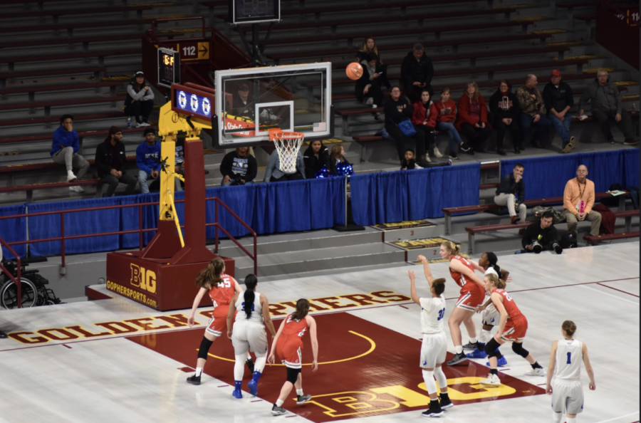 Taylor Woodson, Eighth grade, puts up a free throw in the win. The Royals take on Stillwater in the state championship on Saturday night.