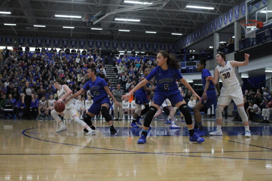 Amaya Battle, freshman, looks on as the Royals play defense. Battle and the Royals take on Lakeville tomorrow night.