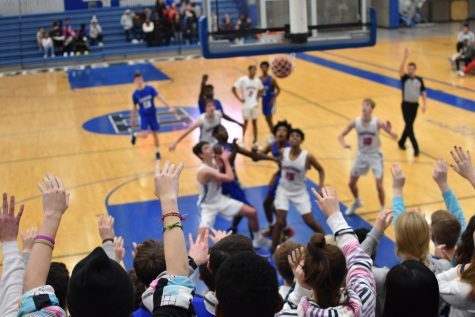 Boys basketball squares off against powerful Redhawks