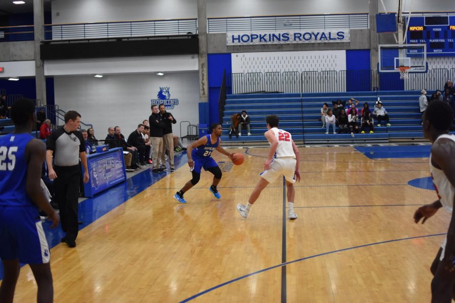 Andre Gray, junior, performs a crossover in a game against Armstrong. Gray and the Royals have a current record of nine wins and three losses