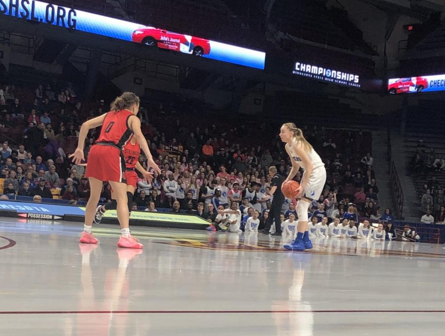 Paige Bueckers, senior, sizes up two Ponies defenders in the first half of the Royals 66-40 state semifinals victory over Stillwater. Bueckers finished the game with 15 points, 10 rebounds and seven assists